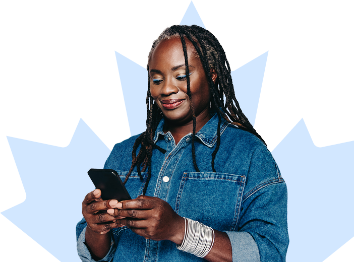 Patient smiles while looking down at their phone.