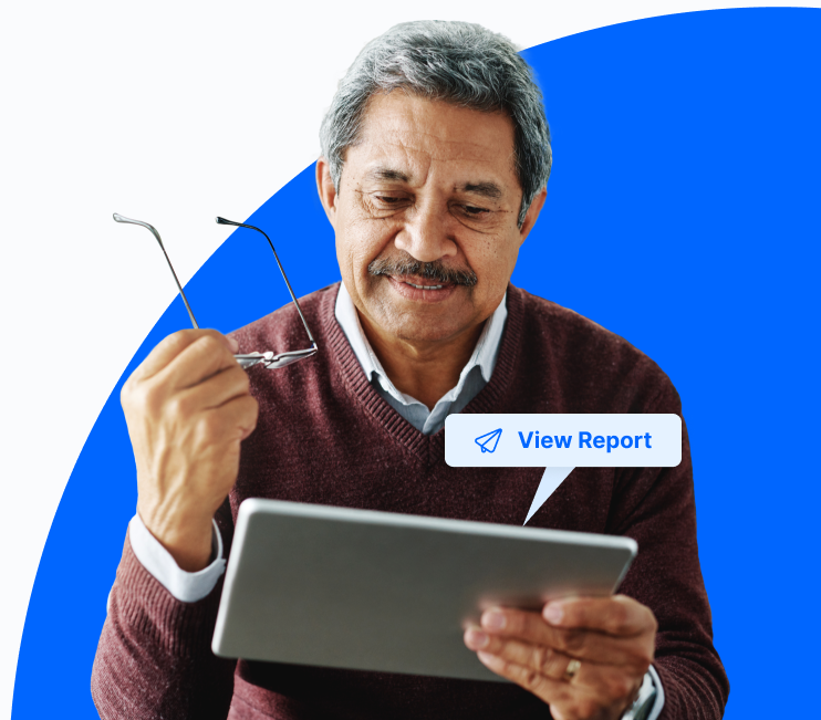 Patient holding glasses in one hand and tablet that looks like an iPad in another. A message bubble with the text “View Report” floats above the tablet.