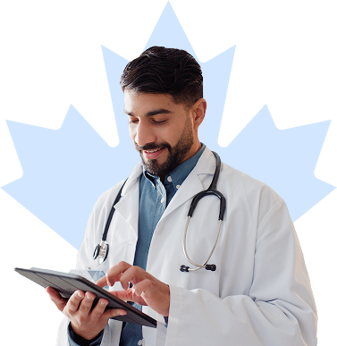Physician smiles in front of a maple leaf background while looking down at their tablet.