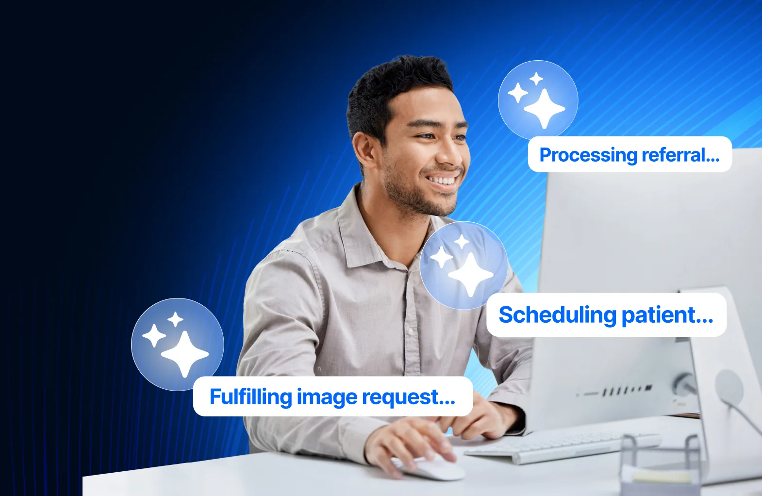 A smiling healthcare clerk works at his desktop computer while sparkle icons and status pills float around him, reading: processing referral, scheduling patient and fulfilling image request.
