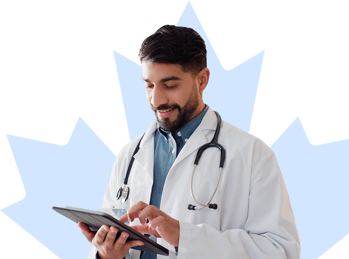 Physician smiles in front of a maple leaf background while looking down at their tablet.