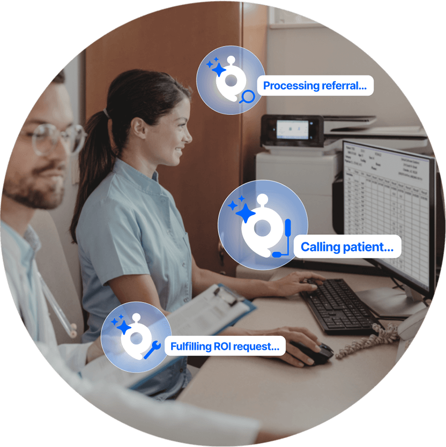 Two healthcare staff members sit side by side: one works at her desktop computer, while the other holds a clipboard. The following text overlays the image: processing referral, calling patient and fulfilling ROI request.