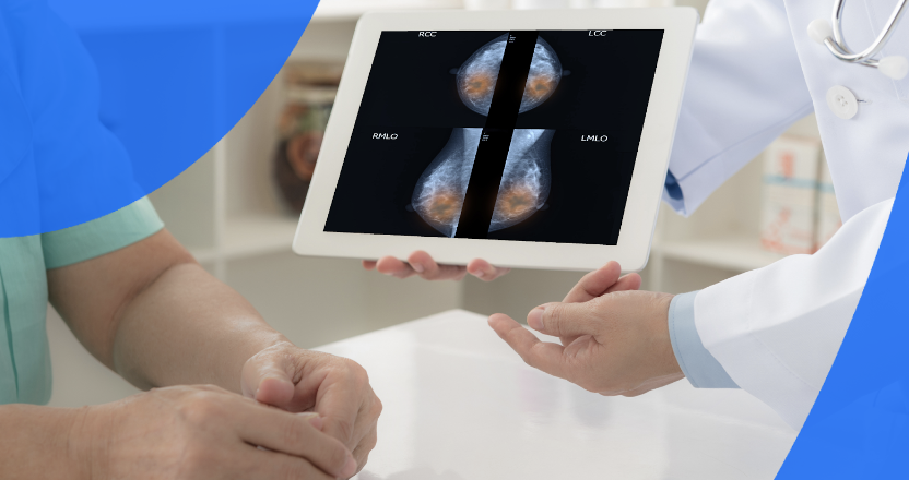 Doctor showing a patient mammograms on a tablet