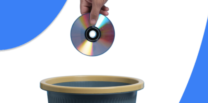 Hand dropping CD in a trash bin
