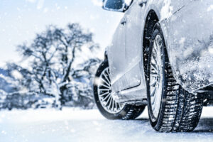 Car tires driving on snow