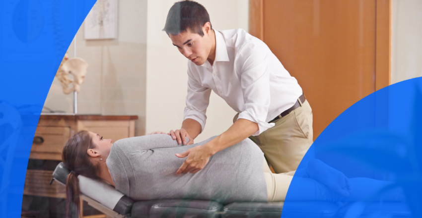 Chiropractor treating patient for spinal injury