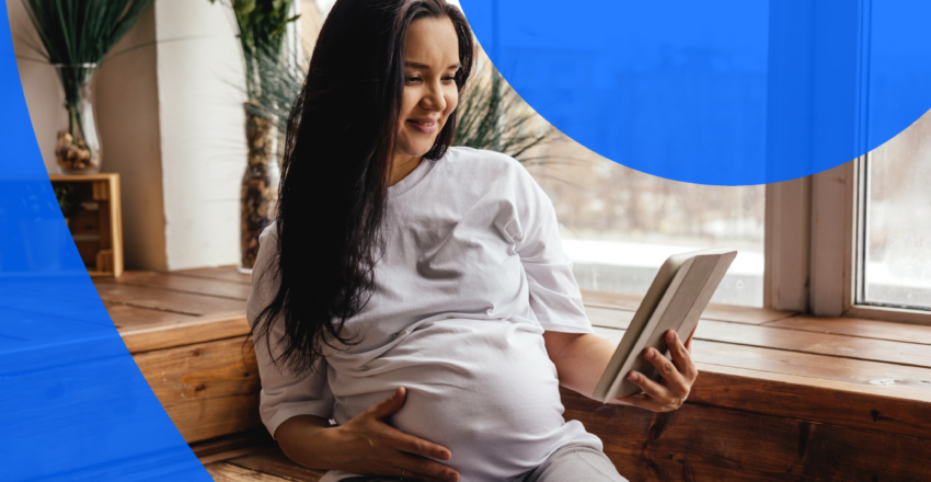 Pregnant woman reading imaging report on a tablet