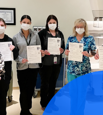 Sault Area Hospital Staff Holds PocketHealth Sign Up Forms for World Health Day Competition 2023