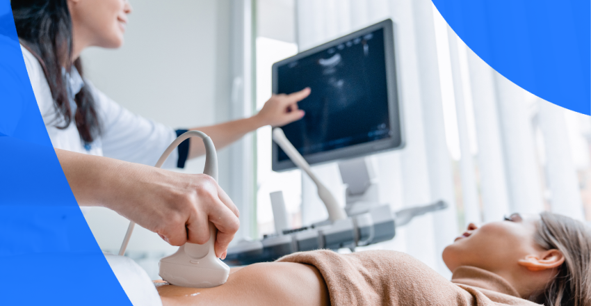 A technician performing an abdominal ultrasound