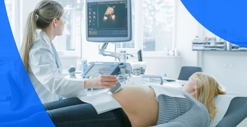 A technician performing an ultrasound on a pregnant woman