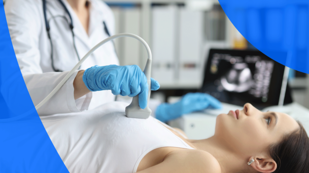 A technician performing a heart ultrasound on a woman
