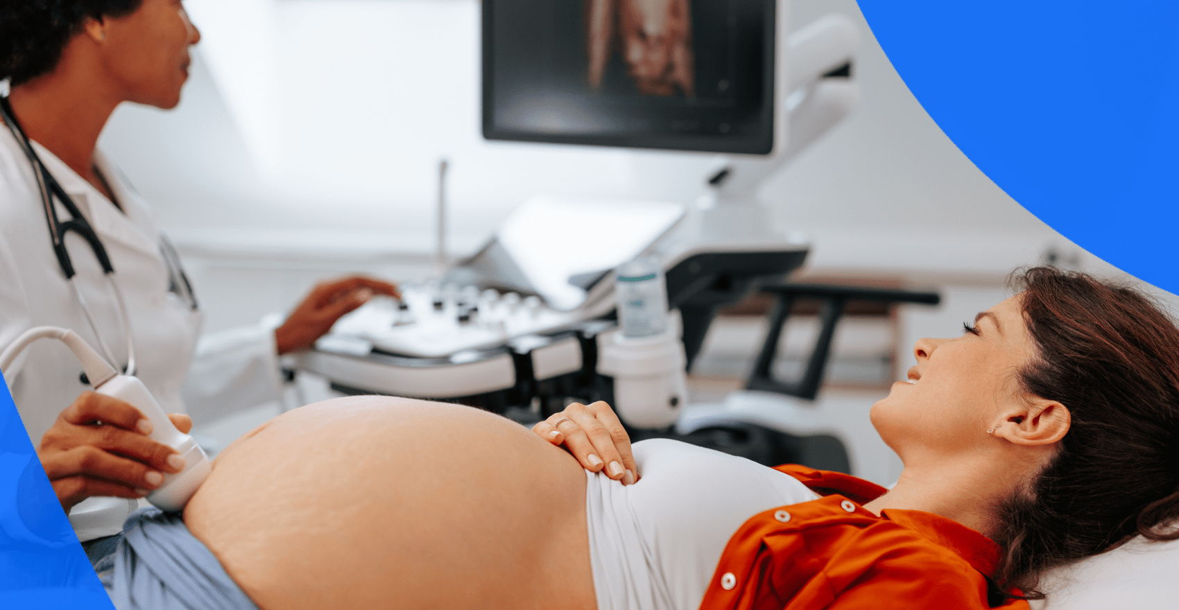 Pregnant patient and sonographer during a prenatal ultrasound