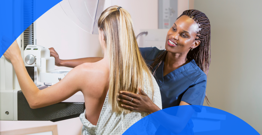 Patient getting a mammogram from a technician