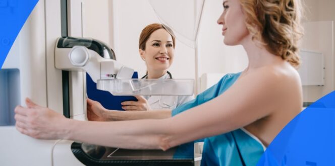 Patient and technician during a mammogram