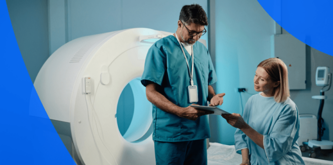 Patient and technician by a CT scan machine