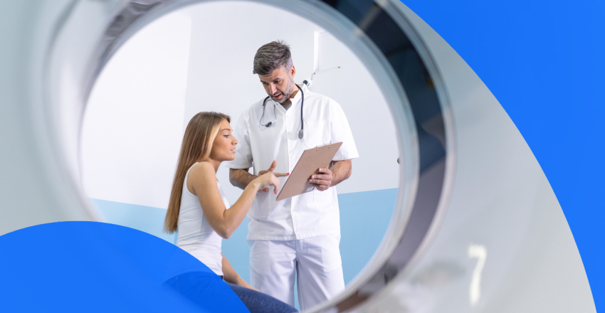 Patient talking with CT scan technician