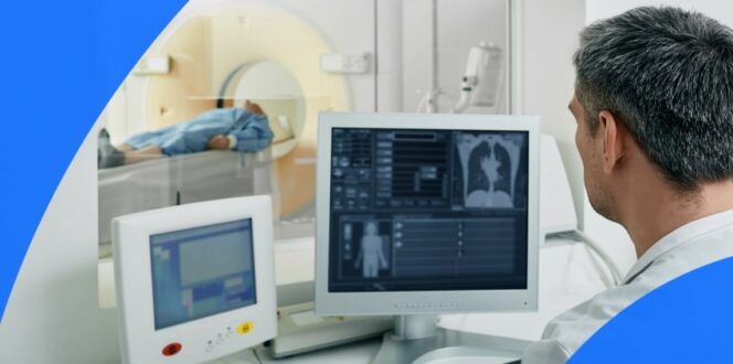 Patient and technician at a CT scan machine