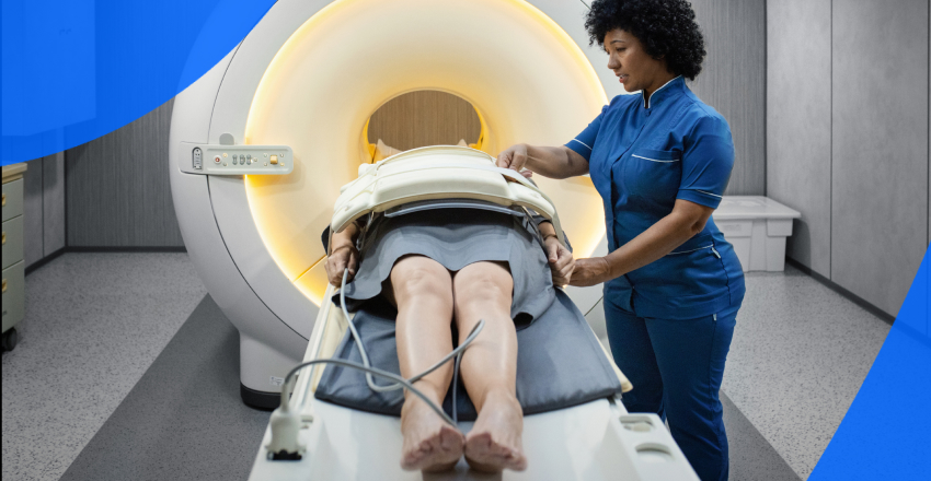 Radiology technician assists a patient lying on bed of an MRI machine to determine bladder cancer diagnosis.