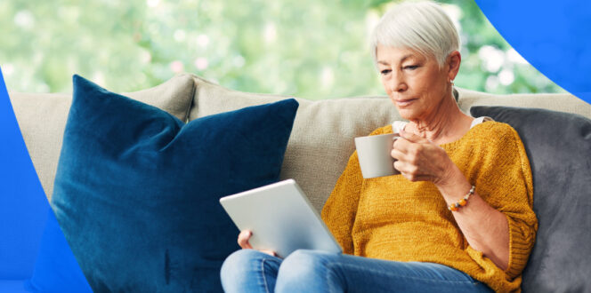 elderly woman sitting and reviewing her electronic health records on her tablet in Canada