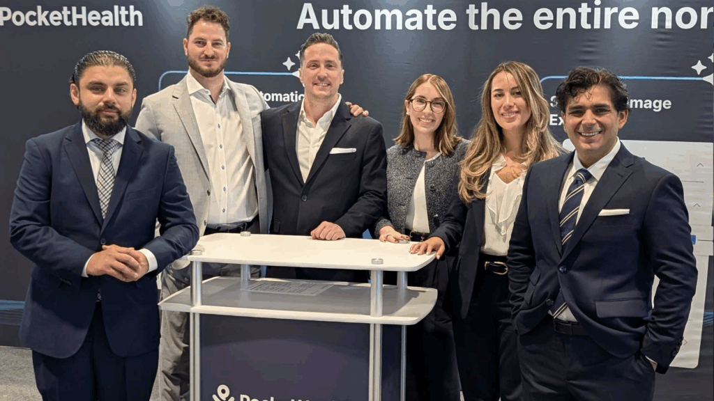 Six PocketHealth employees at the show floor booth